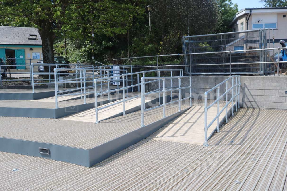 Access ramp baustrades constructed wth steel tube and Interclapm handrail brackets